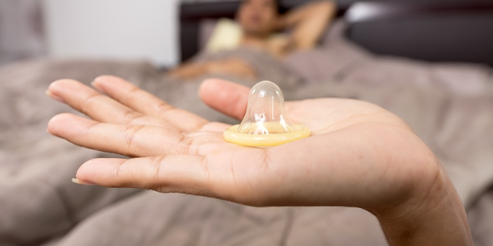 holding a condom